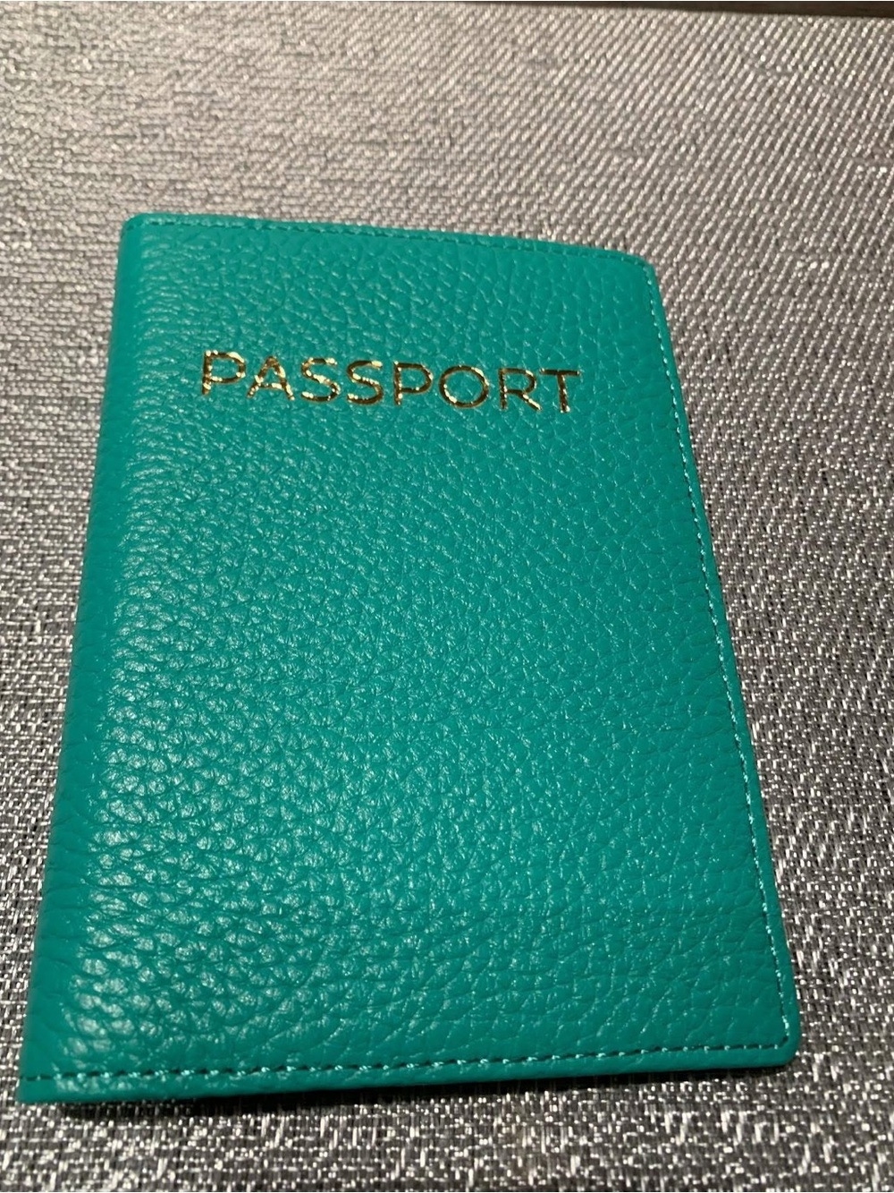 Teal/mint Passport Wallet with Gold Foil details.